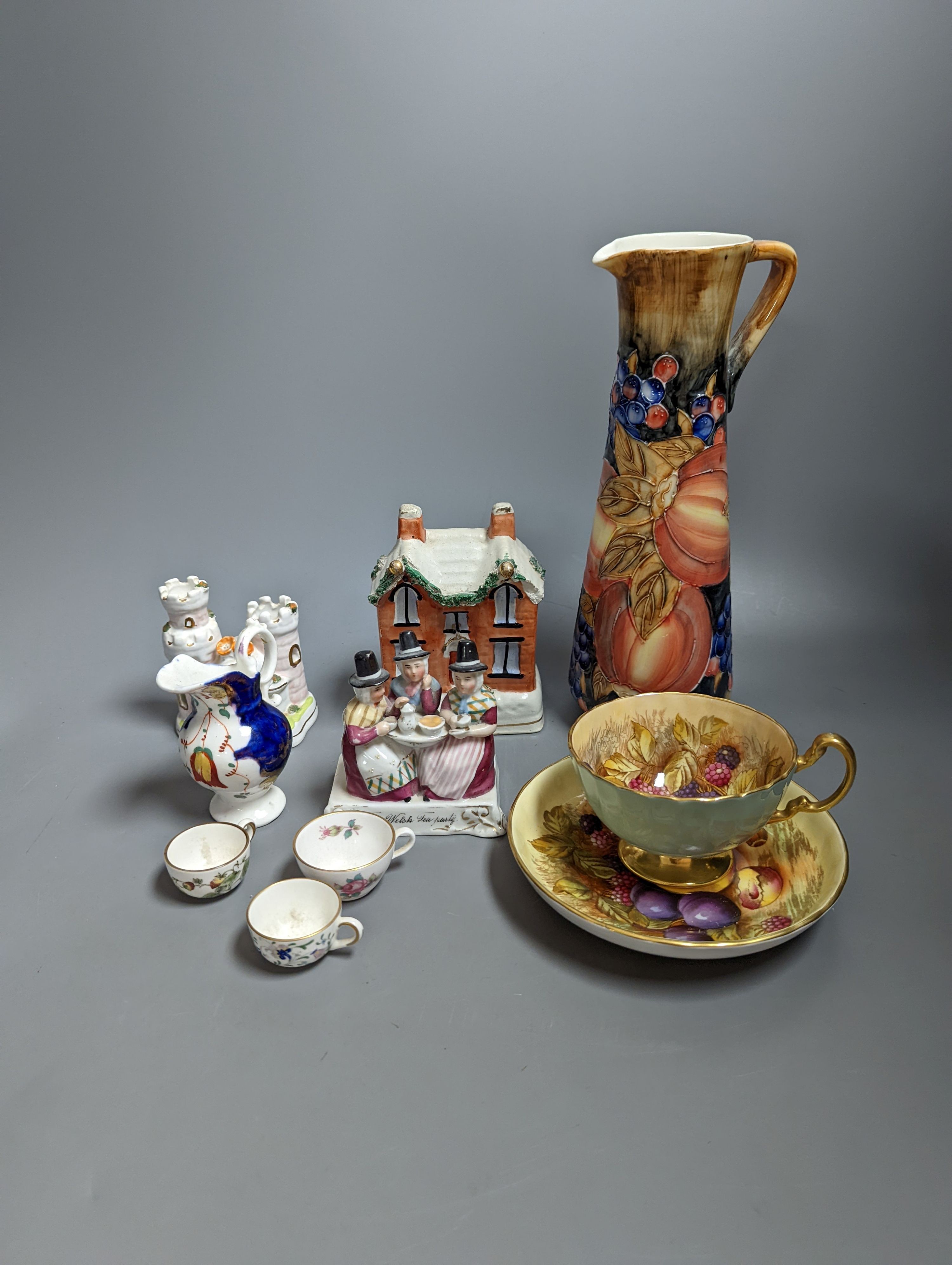 Various miniature Coalport bone china tea sets, a Staffordshire pottery moneybox and other china